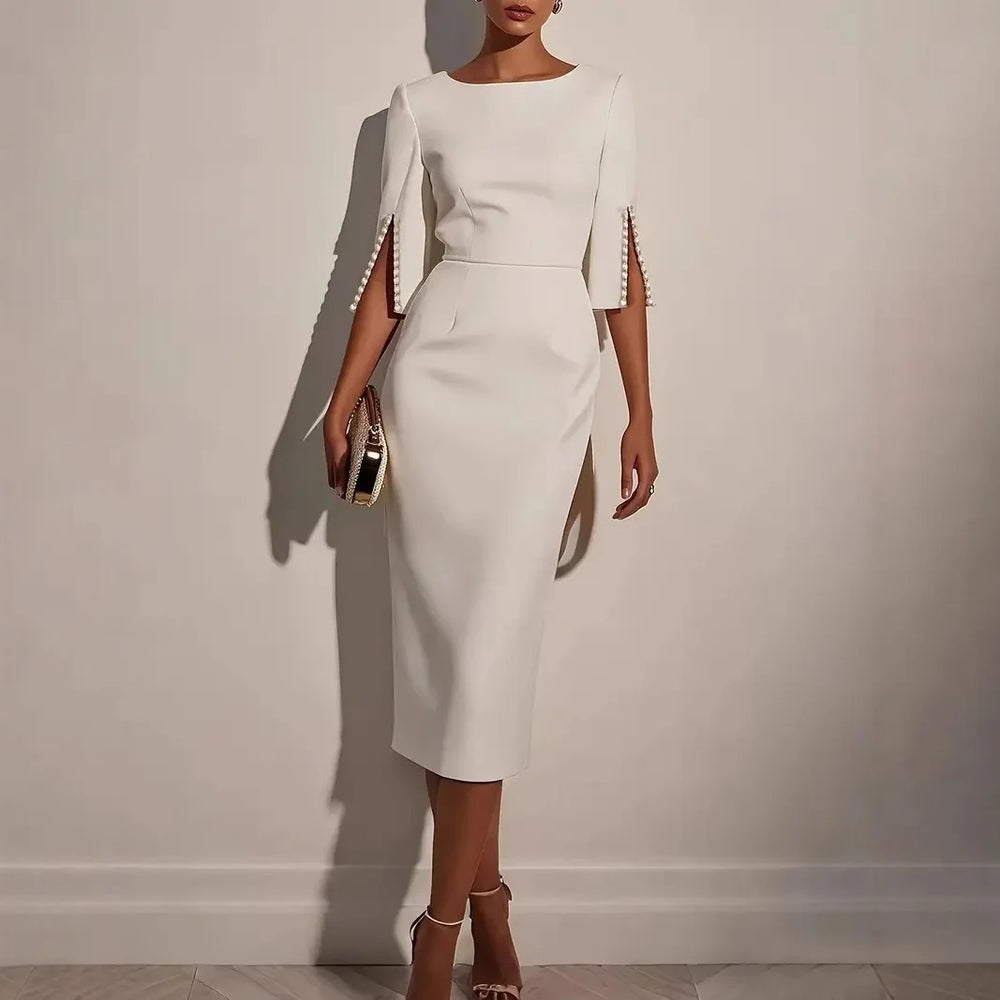 VELOURA | VESTIDO ELEGANTE CON MANGAS ABERTAS DECORADAS CON PERLAS